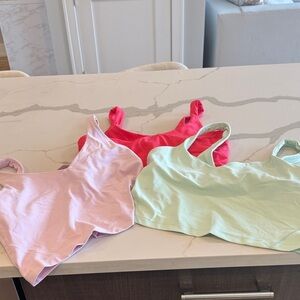 lululemon athletica Pink, Red, and Mint Bras set of 3. Can be sold separately.